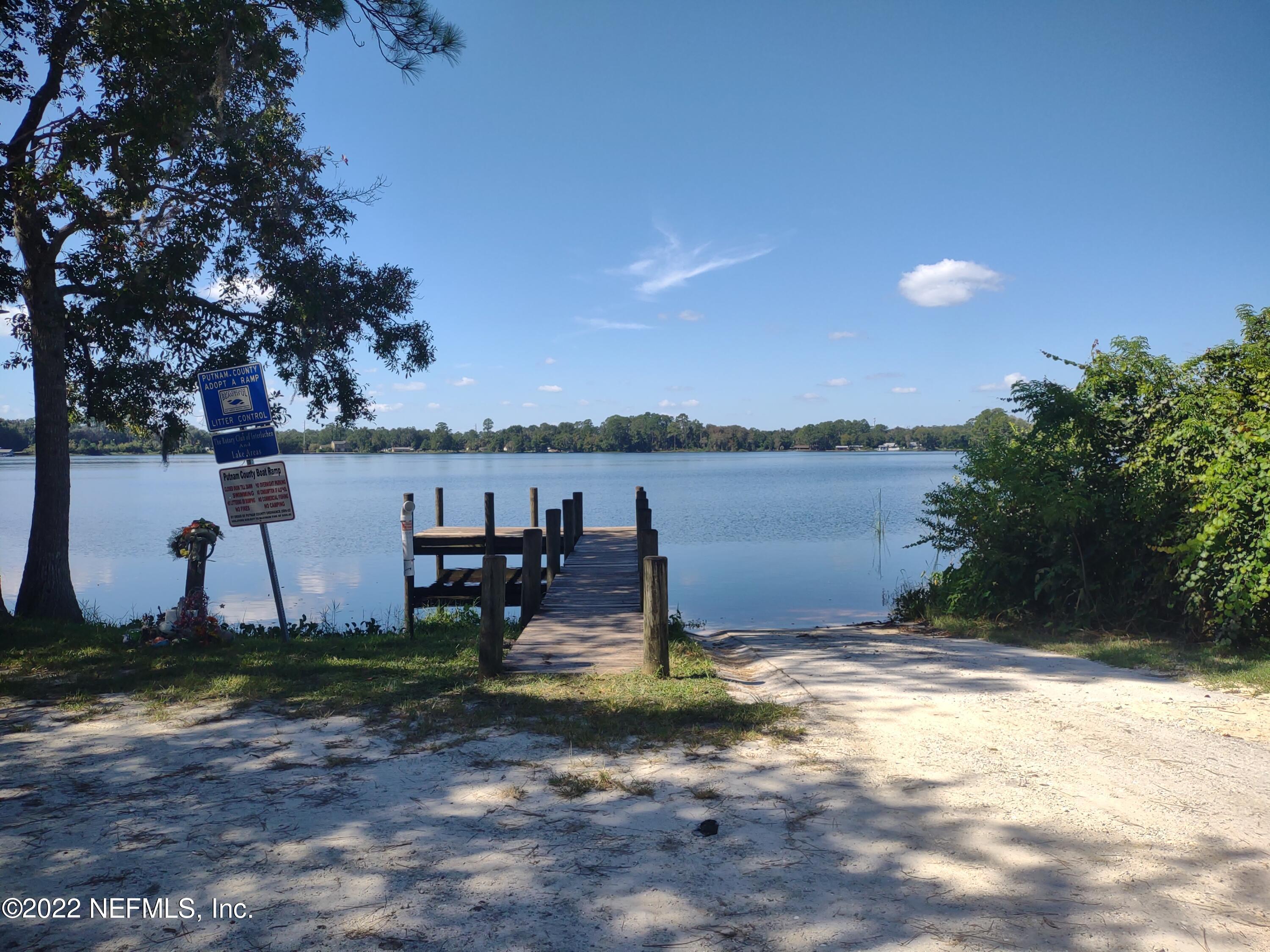 73 Ida Boulevard Interlachen, FL 32148 - Photo 6 of 6 a view of a lake with a yard and a large tree