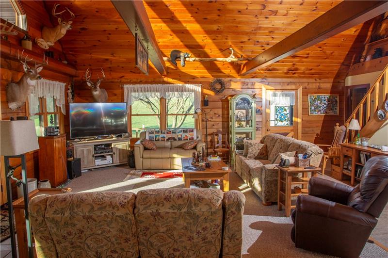 3270 Rustic Lodge Road Indiana, PA 15701 - Photo 20 of 25 a living room with furniture a flat screen tv and kitchen view