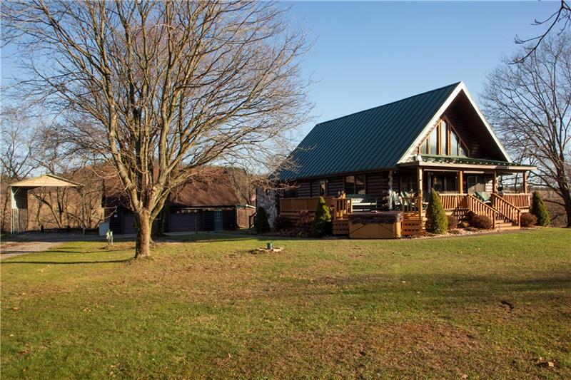 3270 Rustic Lodge Road Indiana, PA 15701 - Photo 5 of 25 a view of a house with a yard covered with trees