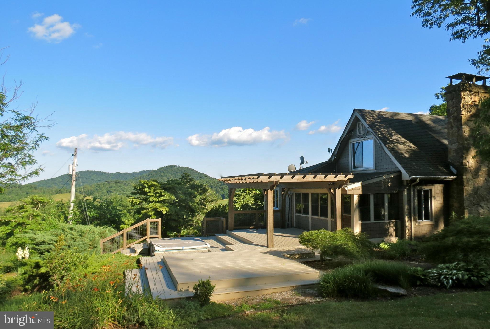 679 Fodderstack Road Flint Hill, VA 22640 - Photo 1 of 24 View of the side deck. It overlooks great views.
