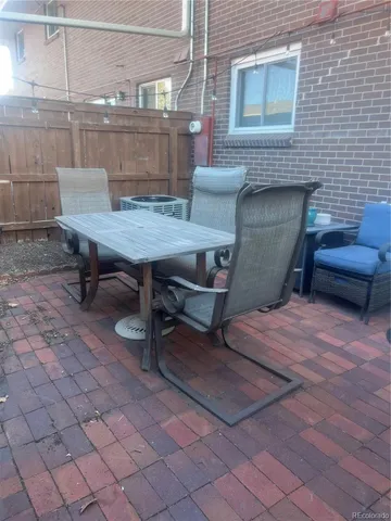 a outdoor space with a couch and chairs