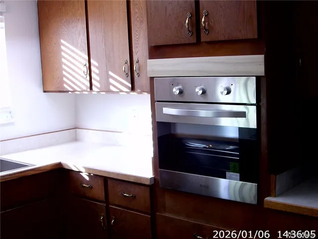a kitchen with a stove and a microwave