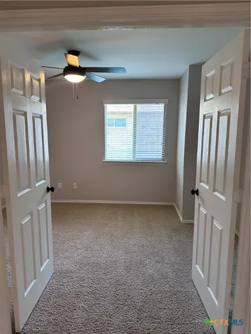 a view of a room that has a large window