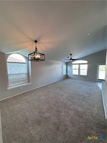 a view of empty room with windows