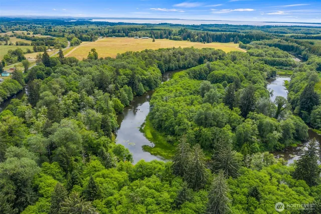 an aerial view of valley and lake