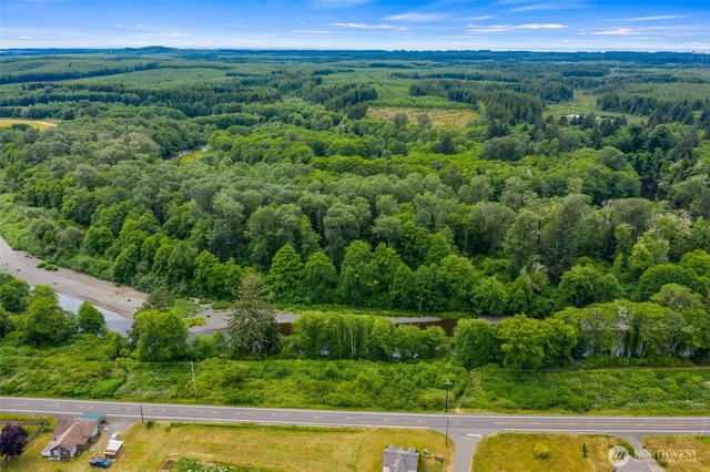 a view of a garden with a lake view