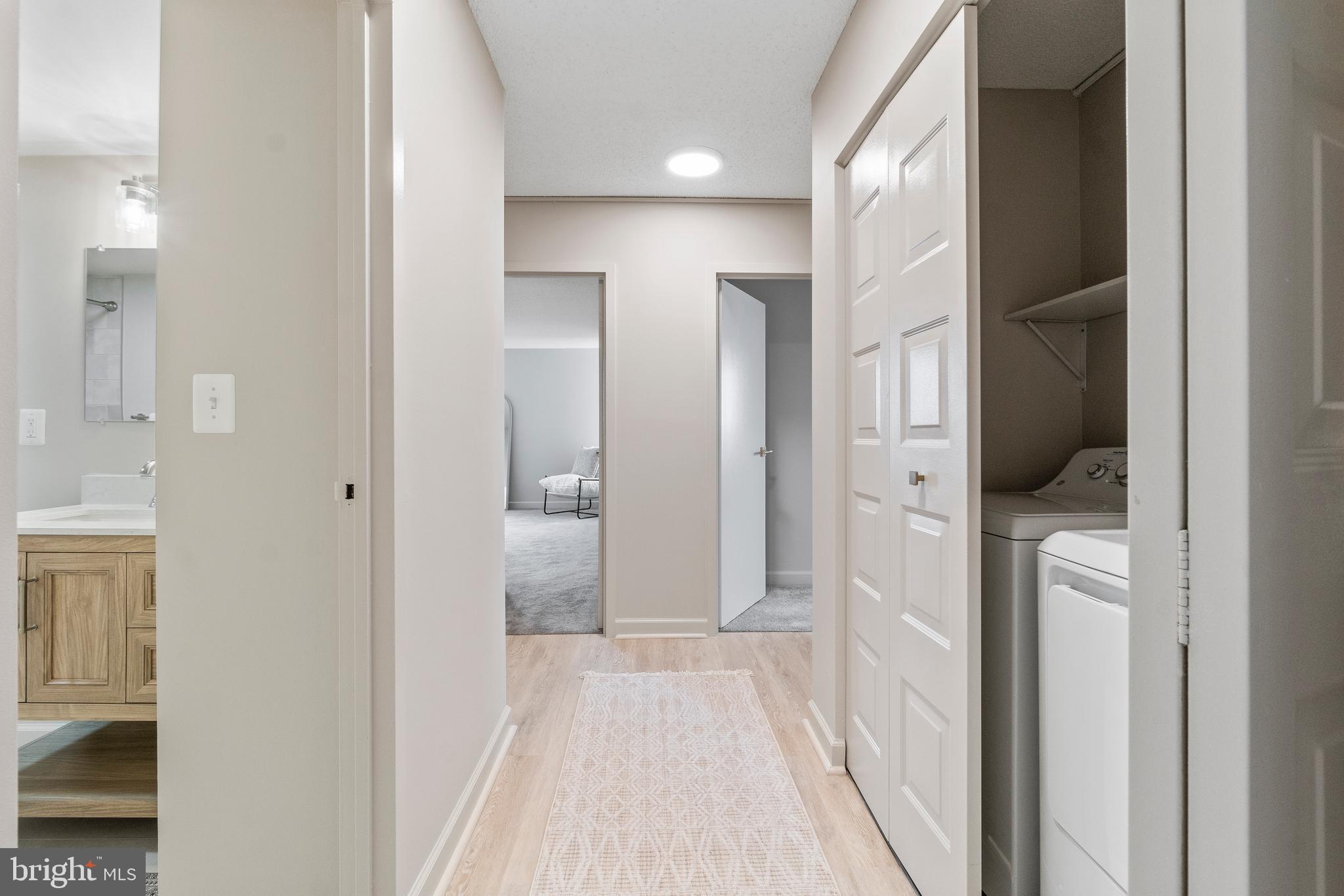 205 East Joppa Road, Unit 2703 Towson, MD 21286 - Photo 23 of 34 a view of a bathroom from a hallway