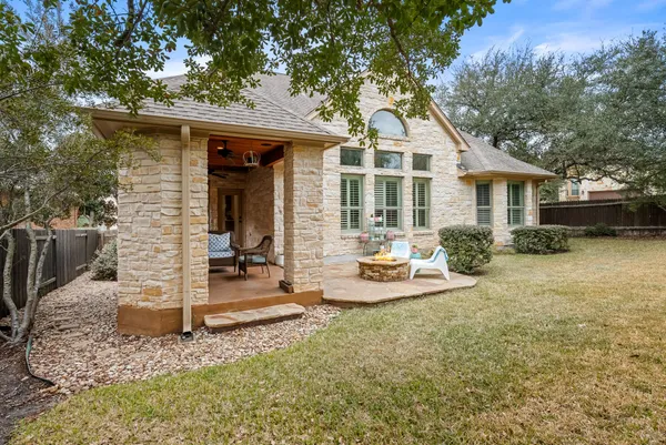 a view of a house with backyard porch and sitting area