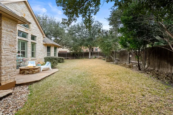 a view of a yard with a house and sitting area