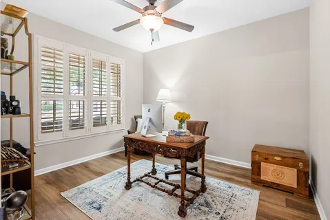 a workspace with furniture and a window