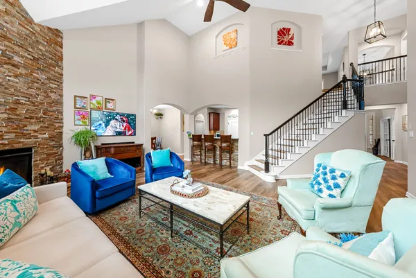 a living room with furniture and a fireplace