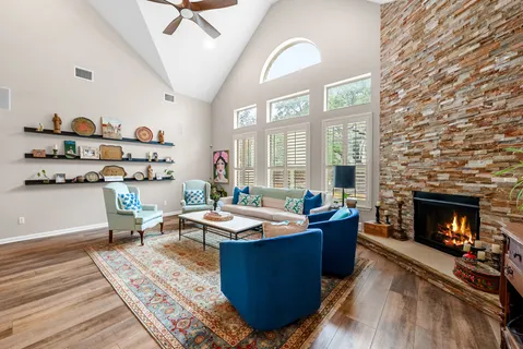 a living room with furniture and fireplace
