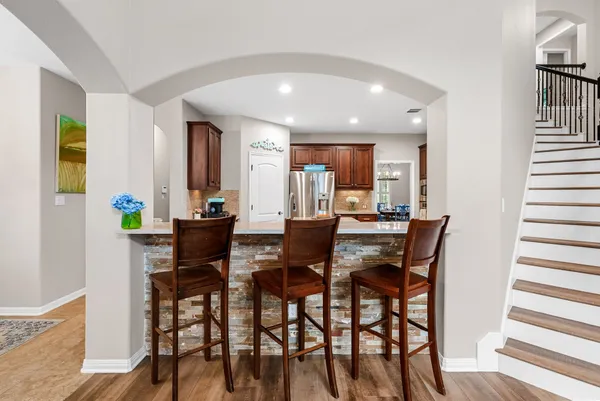 a view of a dining room with furniture and a window