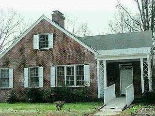 1009 Peace Street Raleigh, NC 27605 - Photo 1 of 1 a front view of a house with a yard