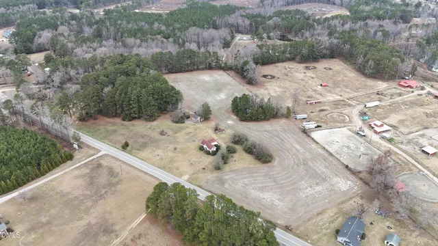a view of a house with a large tree