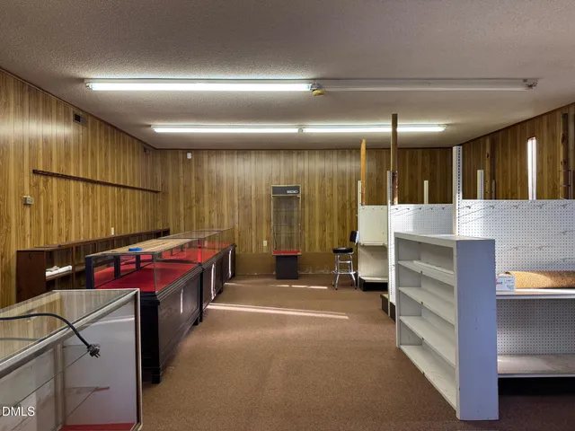a bathroom with a toilet a sink and shower