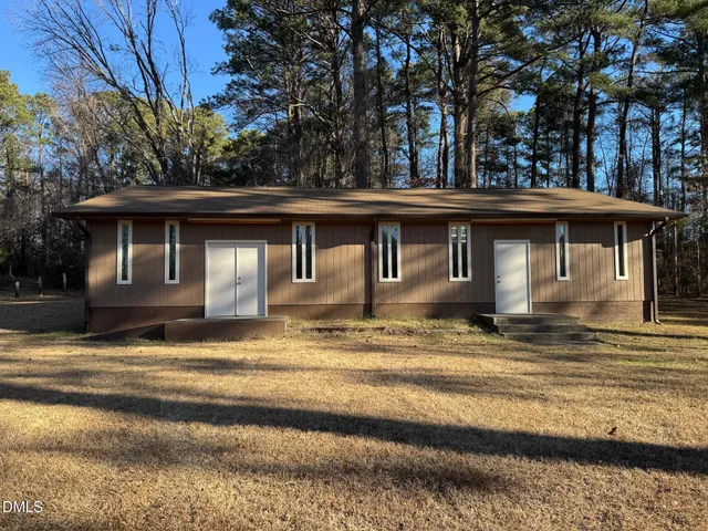 a house with trees in the background