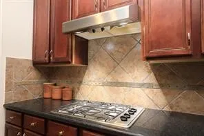 a kitchen with a stove and a cabinet