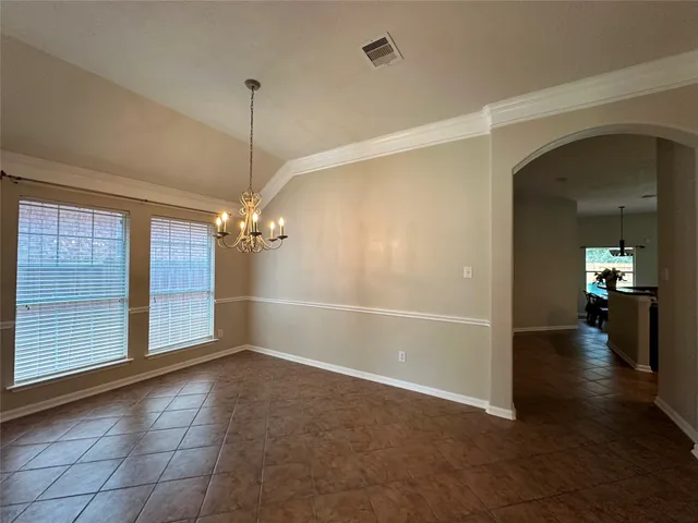 a view of a room with window and hardwood floor