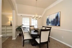 a view of a dining room with furniture and window