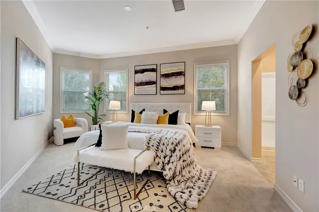 a bedroom with furniture and a large window