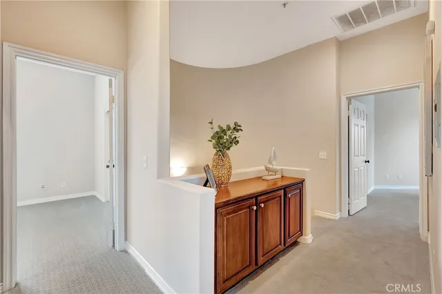 a view of a hallway with front door