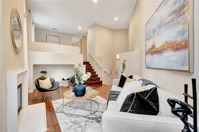 a living room with furniture and a painting