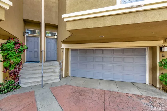 a front view of a house with a garage