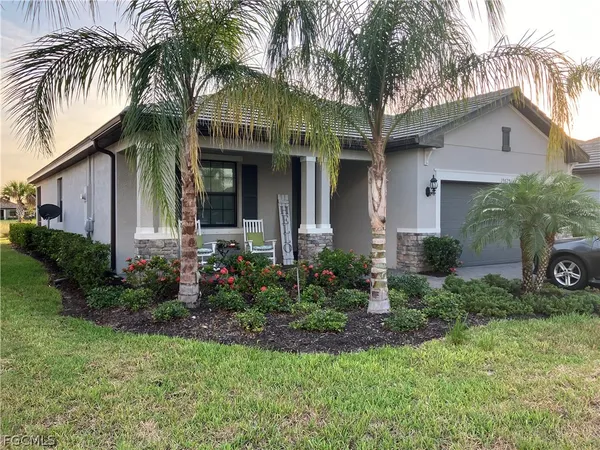 a front view of house with yard and green space