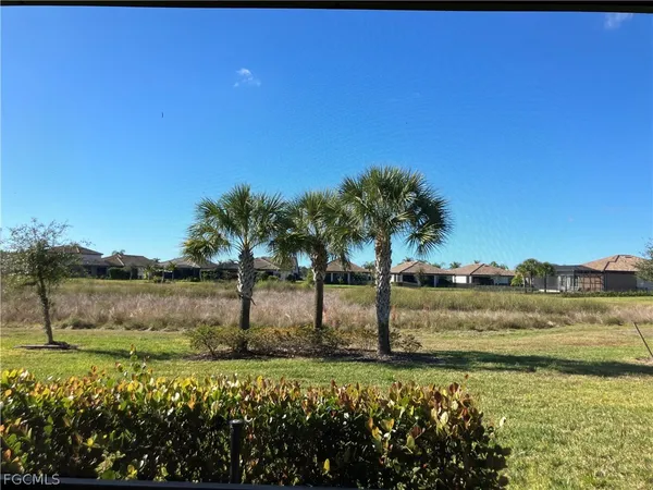a view of a lake with a house in background