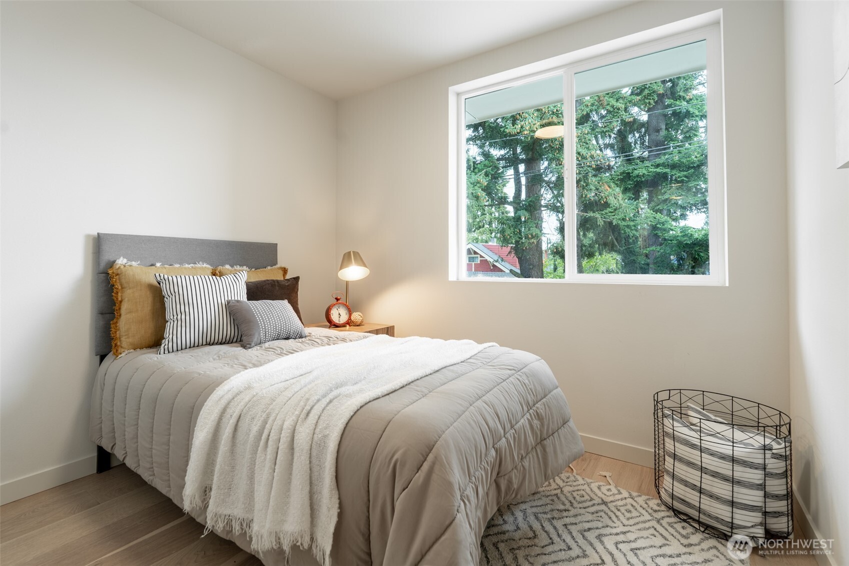 2108 15th Avenue South, Unit B Seattle, WA 98144 - Photo 25 of 40 a bedroom with a bed and a window