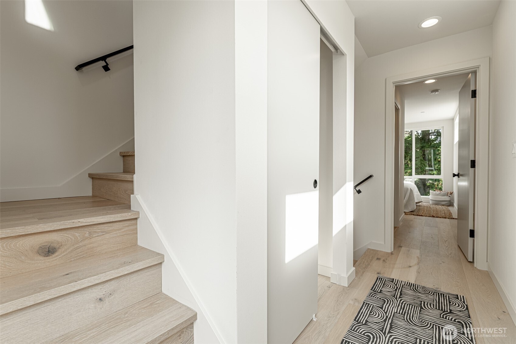 2108 15th Avenue South, Unit B Seattle, WA 98144 - Photo 28 of 40 a view of a hallway with bathroom and wooden floor