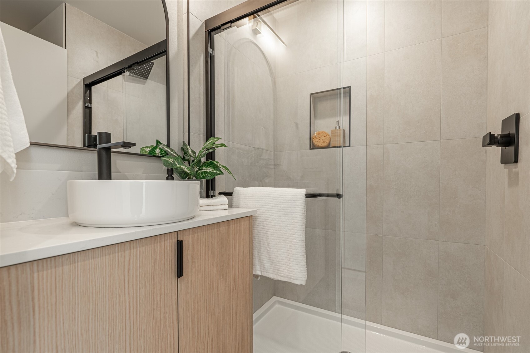 2108 15th Avenue South, Unit B Seattle, WA 98144 - Photo 30 of 40 a bathroom with a sink and a mirror