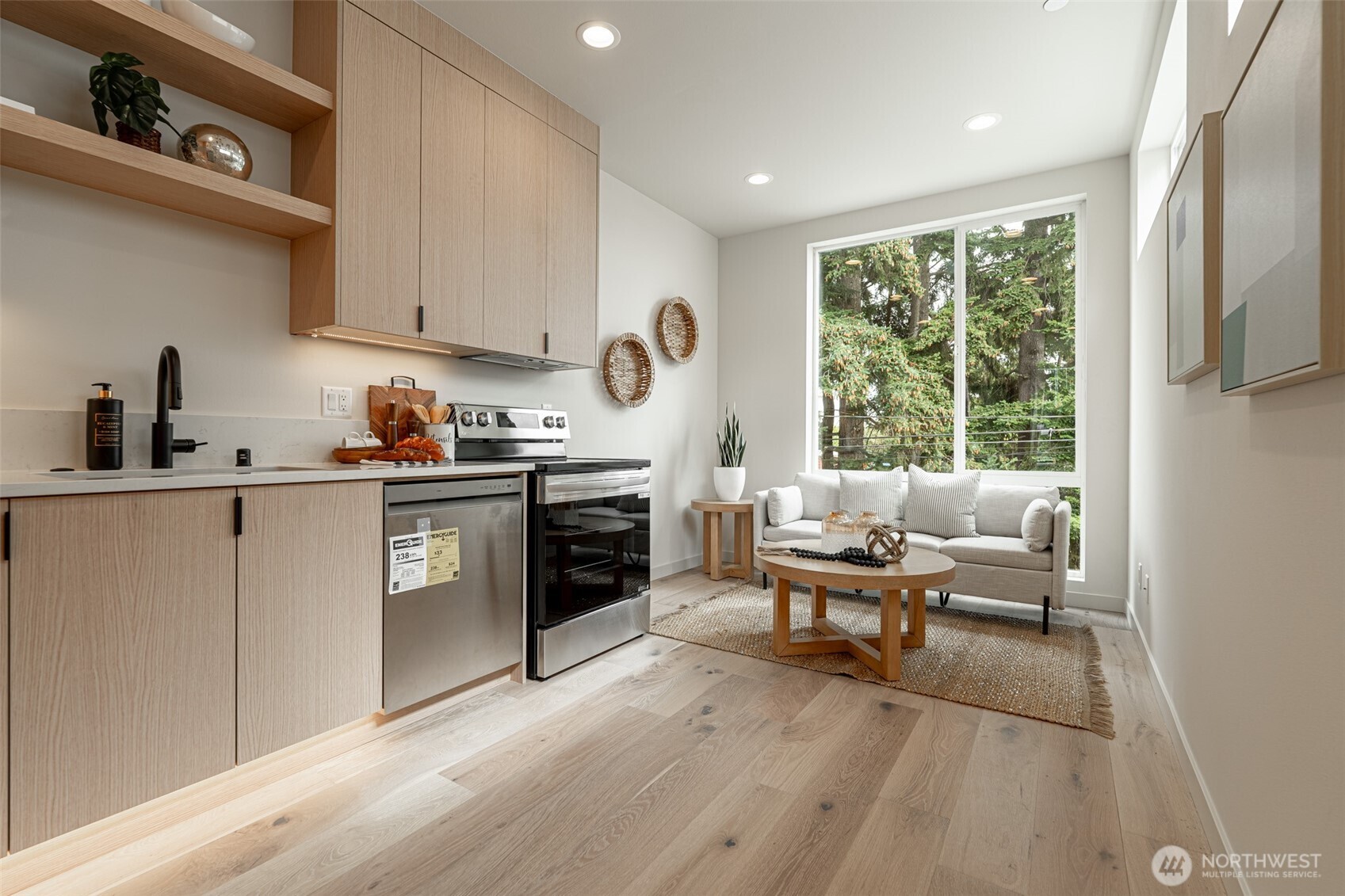 2108 15th Avenue South, Unit B Seattle, WA 98144 - Photo 8 of 40 a kitchen with a sink a window and stainless steel appliances