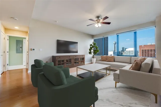 a living room with furniture and a flat screen tv