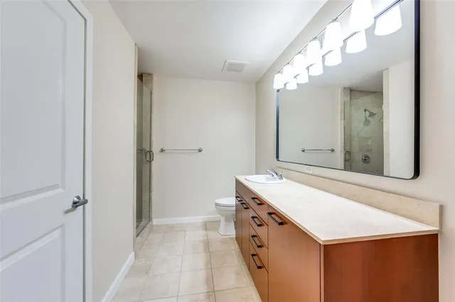 a bathroom with a sink a vanity and a mirror