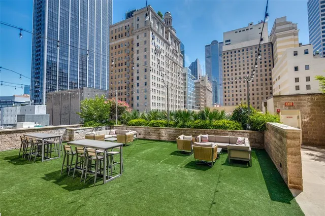 a view of a house with backyard sitting area and garden