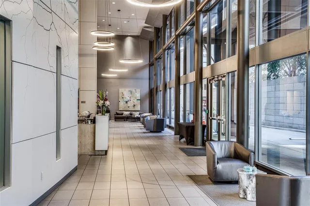 a lobby with furniture and a hallway