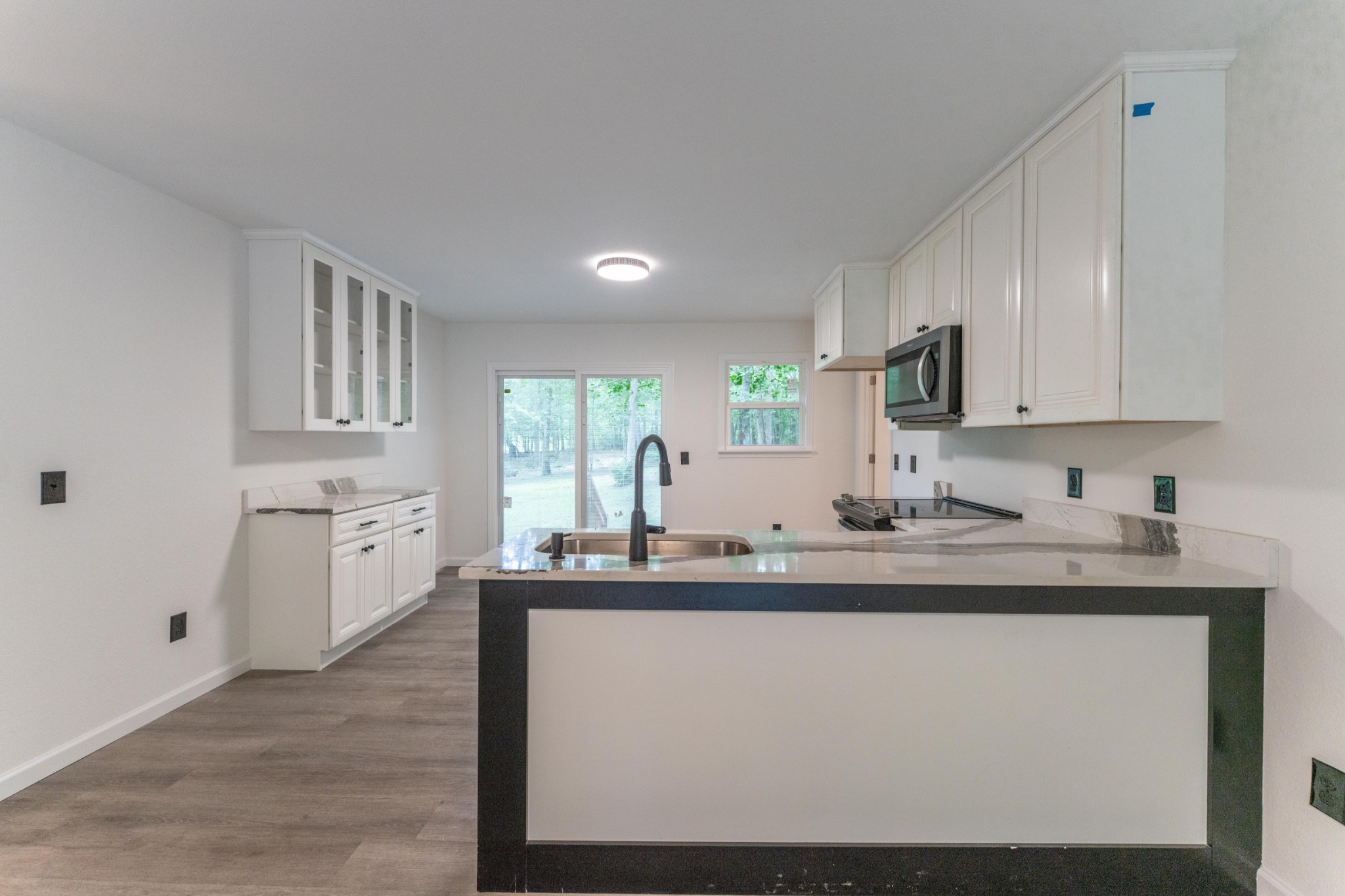 316 Kerrigan Road Crossville, TN 38555 - Photo 5 of 19 a kitchen with kitchen island granite countertop a sink cabinets and stainless steel appliances