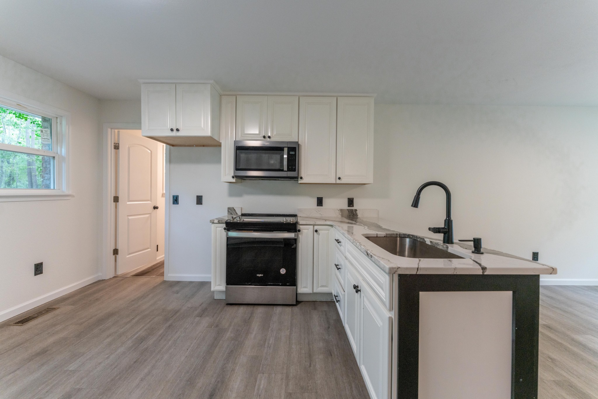 316 Kerrigan Road Crossville, TN 38555 - Photo 6 of 19 a kitchen with a sink cabinets and appliances
