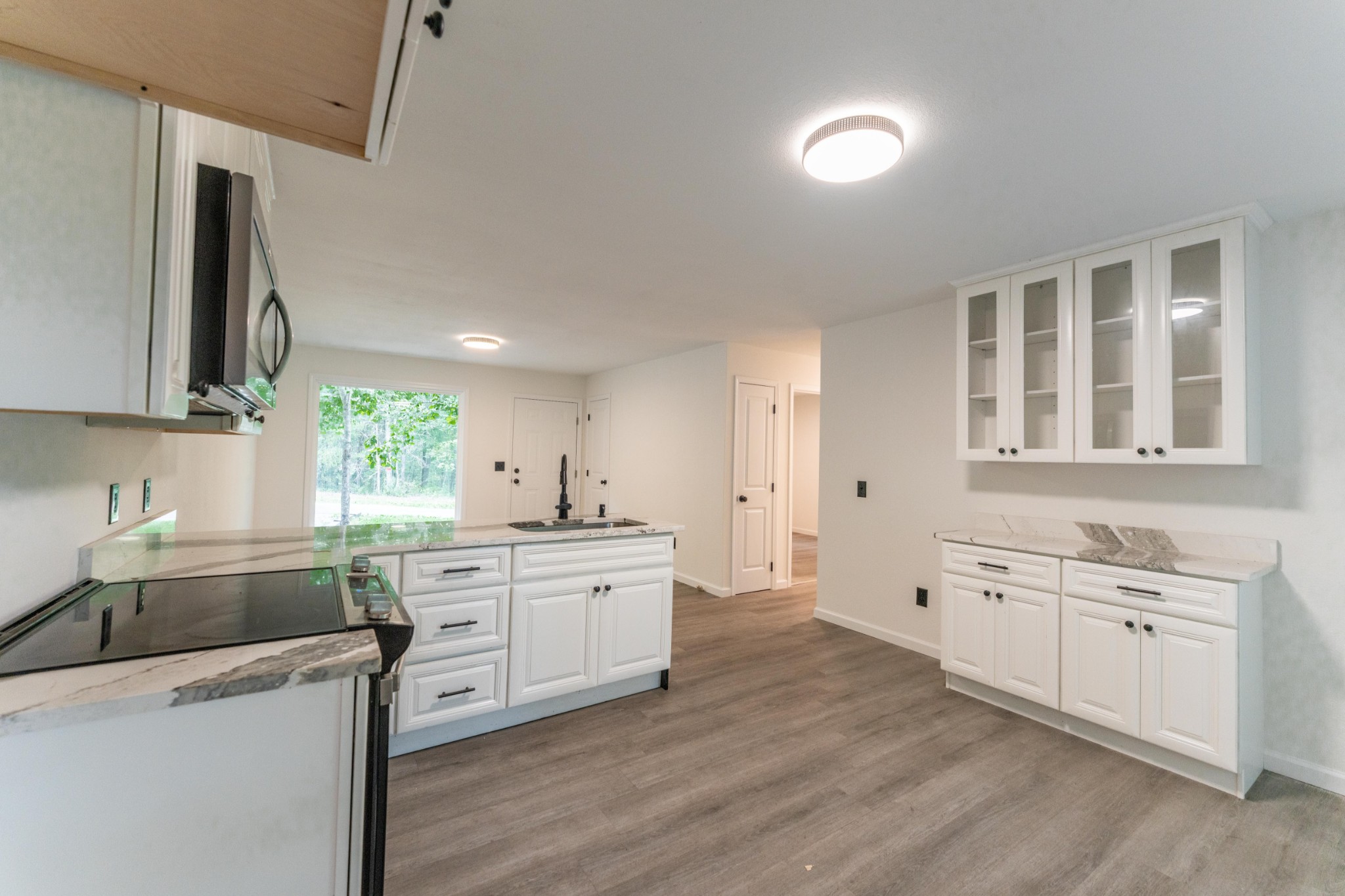 316 Kerrigan Road Crossville, TN 38555 - Photo 8 of 19 a kitchen with a sink stove and cabinets