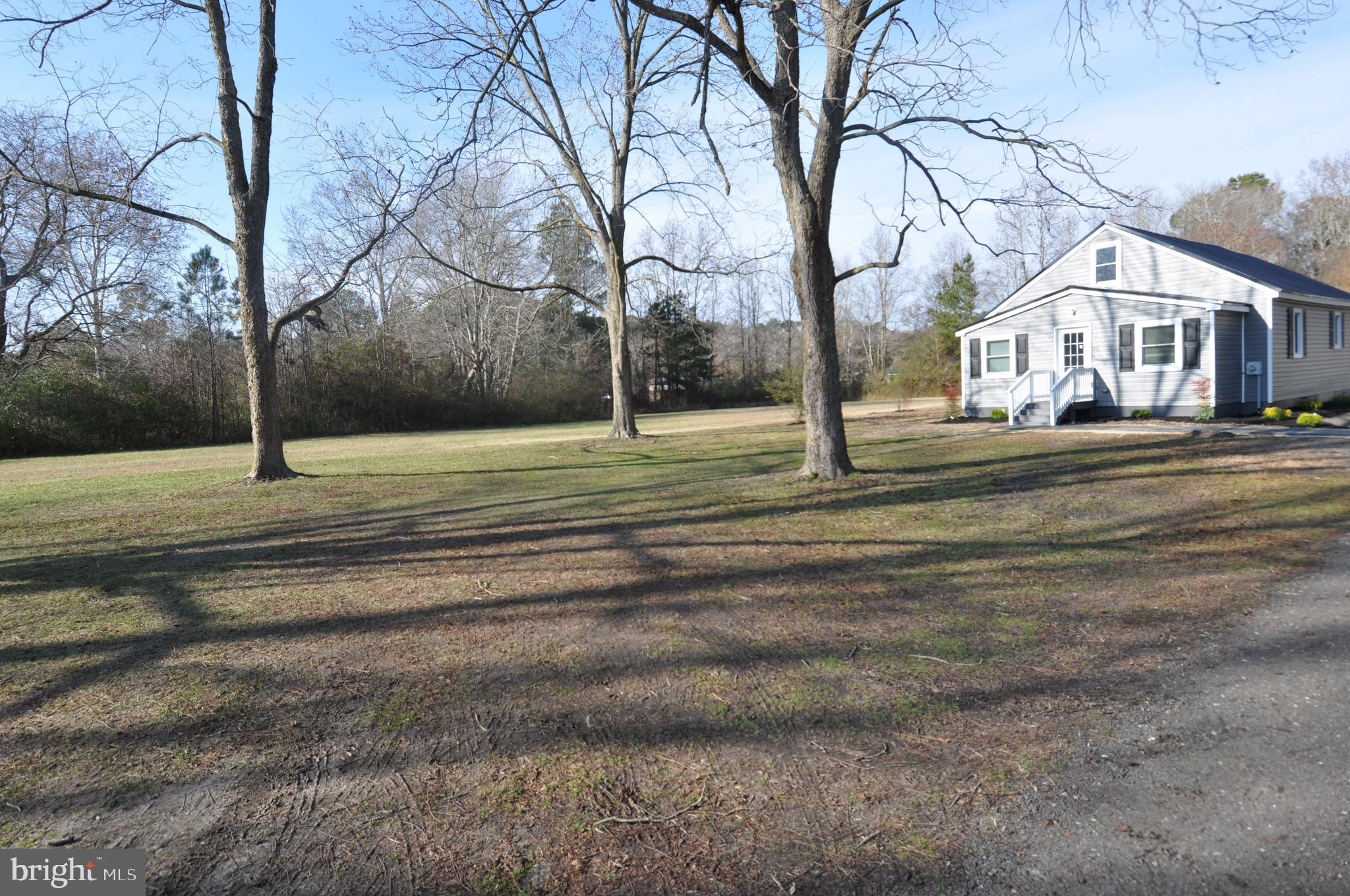 1529 Unionville Road Pocomoke City, MD 21851 - Photo 11 of 33 a house with trees in front of it