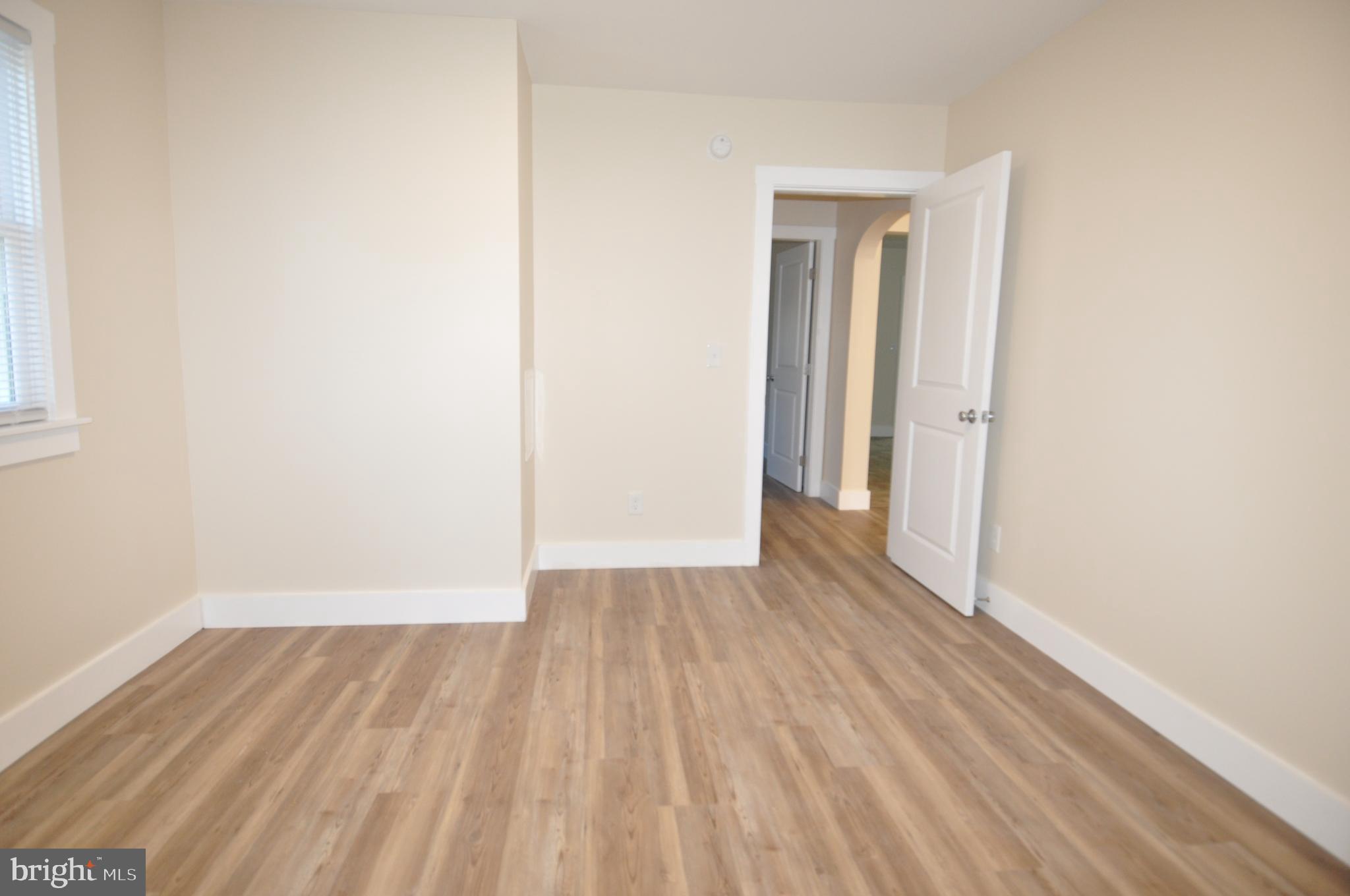 1529 Unionville Road Pocomoke City, MD 21851 - Photo 18 of 33 a view of a room with wooden floor and white doors