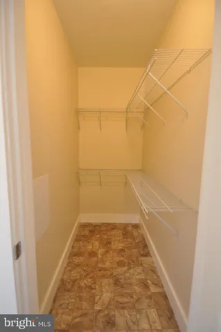 an empty room with a white wall