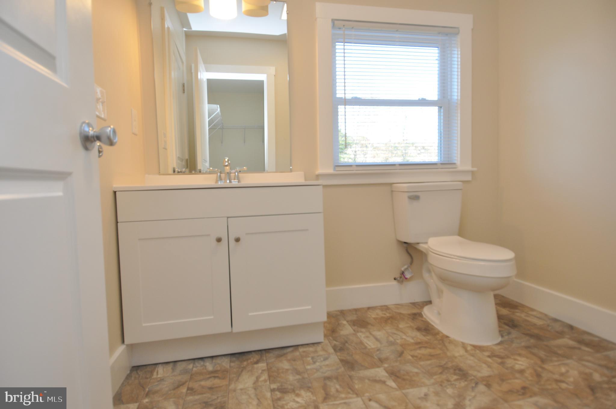 1529 Unionville Road Pocomoke City, MD 21851 - Photo 26 of 33 a bathroom with a toilet sink and window