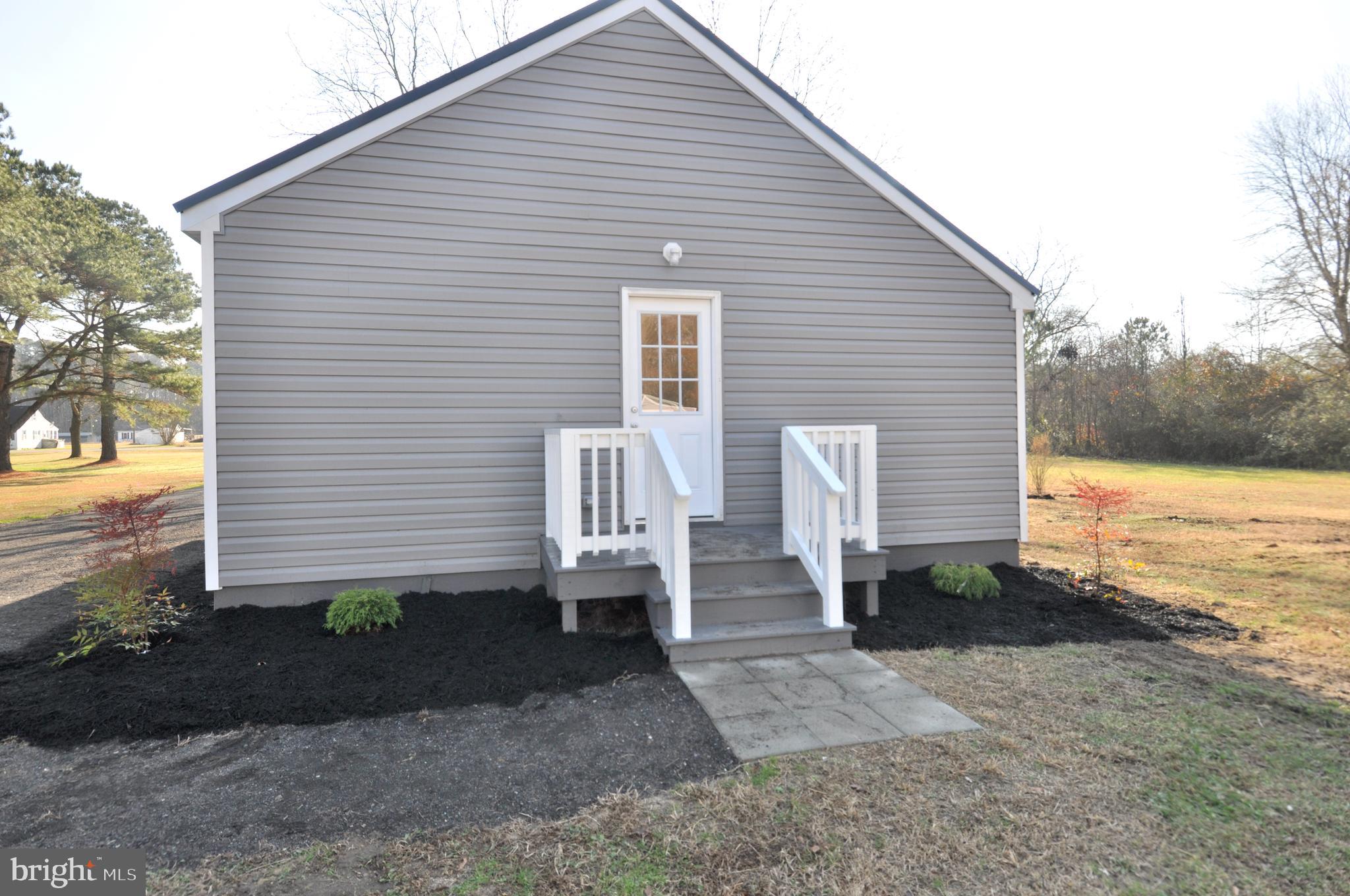 1529 Unionville Road Pocomoke City, MD 21851 - Photo 7 of 33 a front view of a house with garden