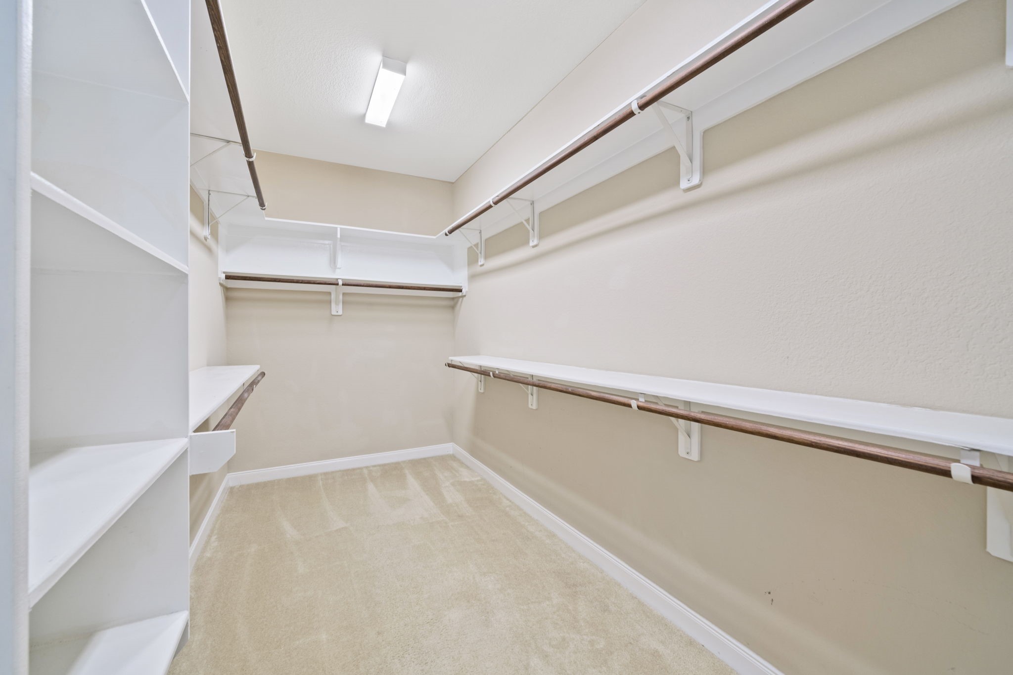 22523 Birch Ridge Meadow Drive Spring, TX 77389 - Photo 24 of 39 a view of an empty walk in closet