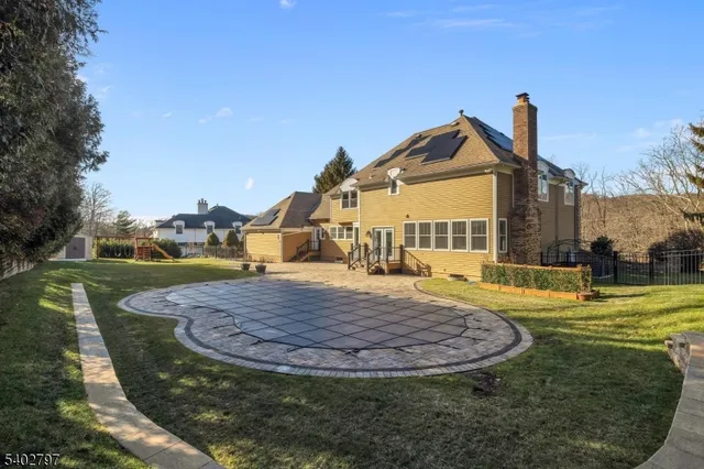 a view of a swimming pool with an outdoor space and seating area