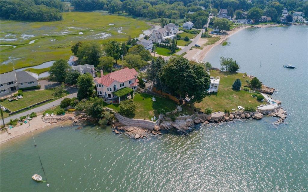 an aerial view of a houses with outdoor space and lake view