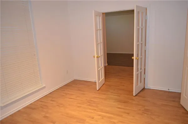 a front view of a house with potted plants